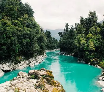 Turquoise river in a forested gorge